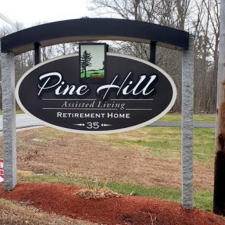 Sign for Pine Hill Assisted Living Retirement Home.