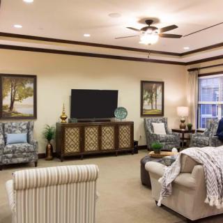 A cozy living room with comfortable seating and elegant decor.