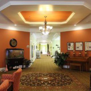 A warmly lit hallway with elegant decor and furnishings.