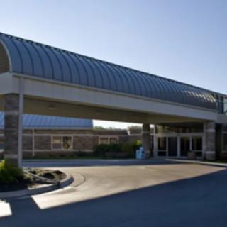 A modern building entrance with a covered walkway.