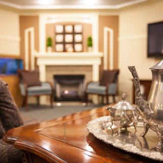A cozy living room featuring stylish furniture, a warm fireplace, and elegant decor.