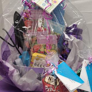 A vibrant and festive gift basket filled with a variety of fun items, perfect for any celebration!