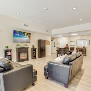 A modern living room with stylish furniture and a cozy fireplace.