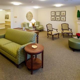 A cozy living room with comfortable seating and elegant decor.