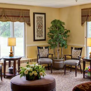 A cozy living room with elegant furniture and warm lighting.