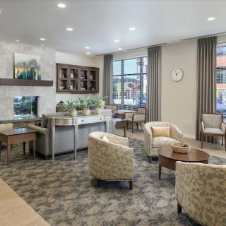 A modern waiting area featuring comfortable seating and stylish decor.