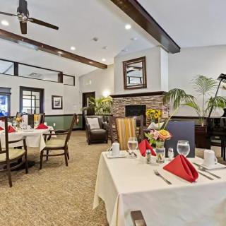 A well-decorated dining room with neatly set tables and stylish interior design.