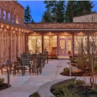 Outdoor patio with evening lighting and seating arrangement.