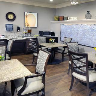 A cozy dining area with modern furniture and neutral tones.