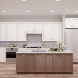 A modern kitchen with white cabinets and a central island.