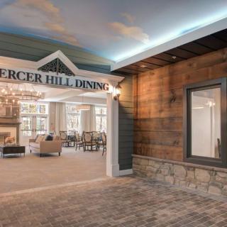 The elegant lobby entrance features a chandelier and comfortable seating area.