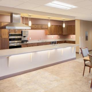 A modern kitchen featuring sleek cabinetry, stainless steel appliances, and elegant lighting.