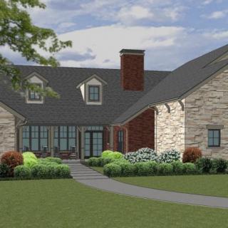 A beautiful modern house with stone and brick exterior surrounded by lush landscaping.