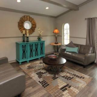 A stylish living room with modern furniture and decor.