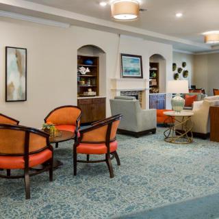 A well-furnished lobby with comfortable seating and tasteful decor.