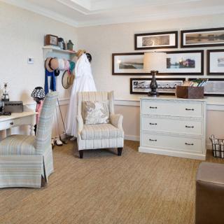 A cozy living room with elegant furnishings and decorative wall art.