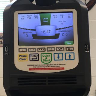 A close-up view of a fitness machine's display panel, indicating various workout metrics.
