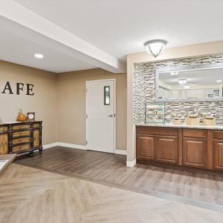 A modern cafe interior with wood flooring and stylish decor.