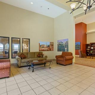 Spacious lobby with comfortable seating and decor.
