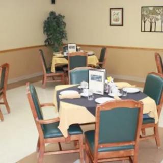 A neatly arranged dining area with tables set for service.