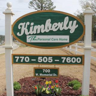 Sign for Kimberly Personal Care Home with contact details.