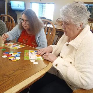 Residents enjoying a friendly game of bingo together.