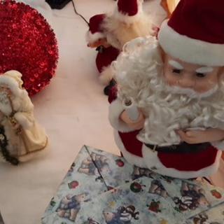 Festive Christmas decorations featuring Santa Claus figurines.