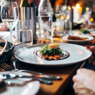 A gourmet dish elegantly presented in a fine dining restaurant setting.