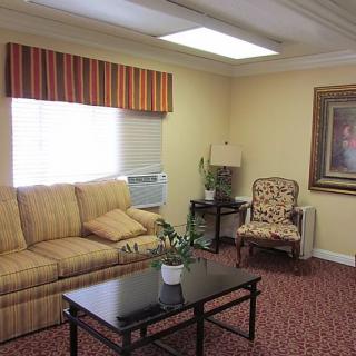 A cozy living room with a sofa, coffee table, and decorative elements.