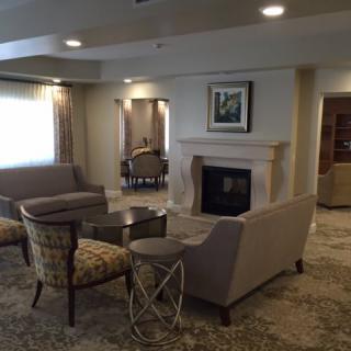 A cozy living room with comfortable seating and a fireplace.