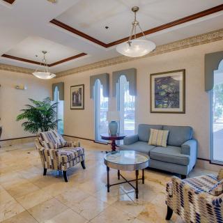 Elegant living room with cozy seating and decorative elements.