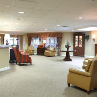 A spacious lobby featuring comfortable seating and elegant decor.