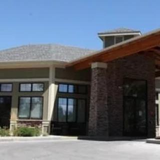 A modern building with a stone faade and an inviting entrance.