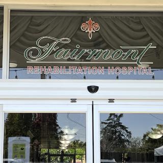 Entrance of the Fairmont Hotel featuring elegant signage.