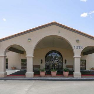 A building with arched entrances and a tiled roof.