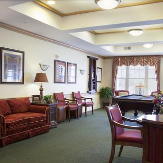 A cozy lobby area with comfortable seating and warm decor.