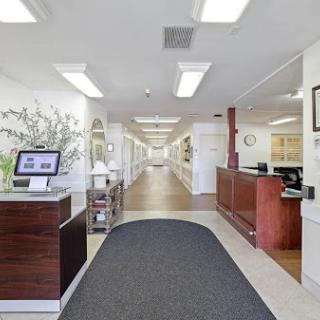 A modern office reception area featuring a welcoming design and organized layout.