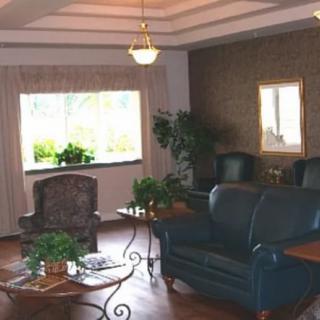 A cozy living room with comfortable seating and natural light.