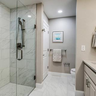 Modern bathroom with a glass-enclosed shower and stylish fixtures.