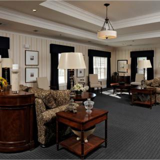 A traditionally styled living room with comfortable seating and elegant decor.