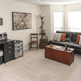 A cozy living room with modern decor and furniture.