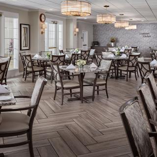 An elegantly designed restaurant dining area with neatly arranged tables and chairs.