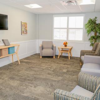 A well-lit waiting room with comfortable seating and modern decor.