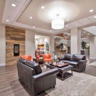 A modern living room with comfortable sofas and elegant lighting.