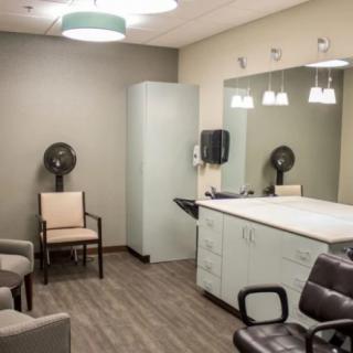 A modern hair salon interior with styling chairs and mirrors.