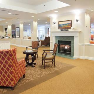 A cozy lobby area with comfortable seating and a fireplace.