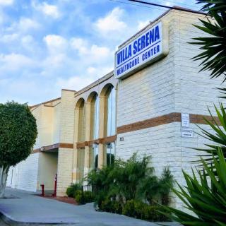 Exterior view of a community center with signage.