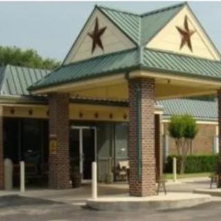 A building entrance with a distinctive star design and columns.
