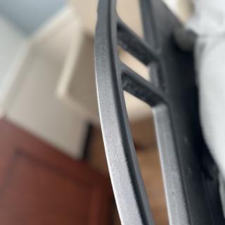 A close-up view of a bed headboard in a bedroom setting.
