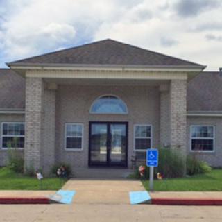 Front view of a modern building with a welcoming entrance.